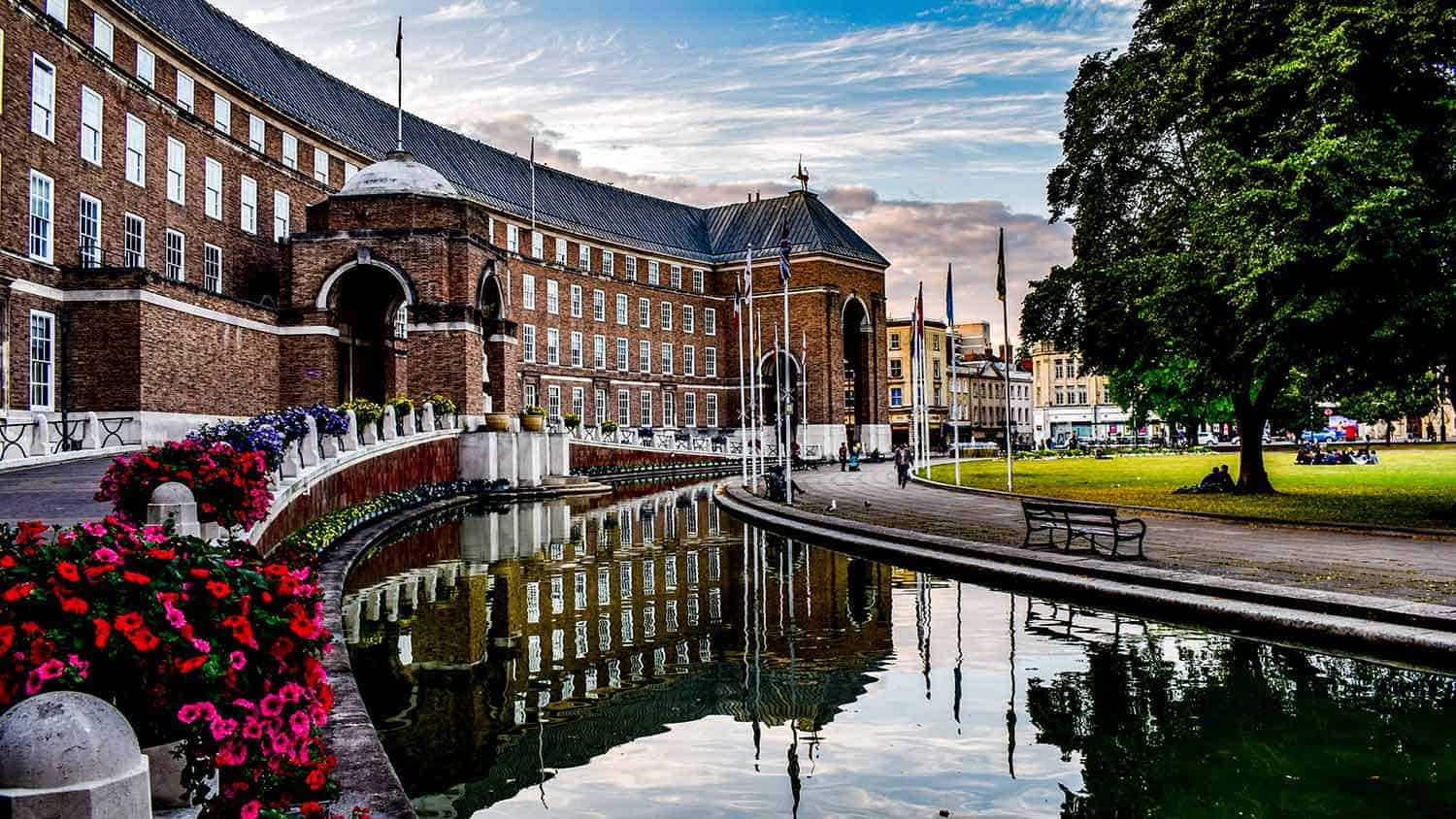 Bristol town hall, a shot of ornamental garden in front of the building, semi circular pond lined with petunias