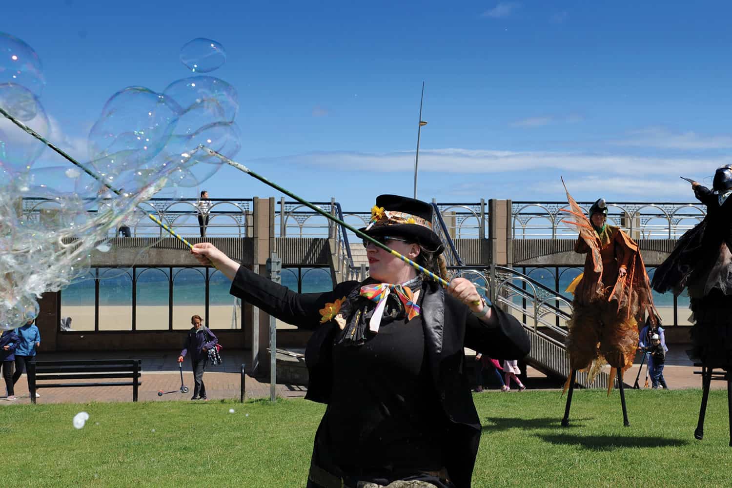 A professional bubble artist blowing bubbles.