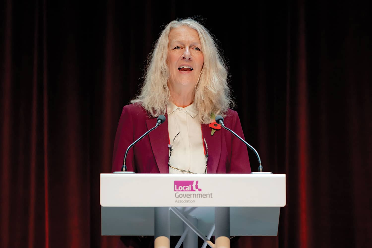 photo of LGA Chair Cllr Louise Gittins speaking from podium at LGA annual conference in Harrogate;